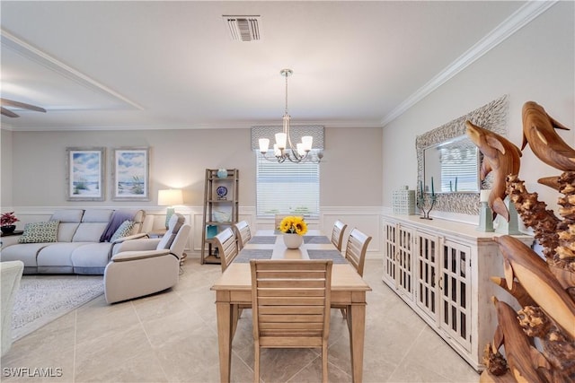 dining space featuring ornamental molding, wainscoting, visible vents, and light tile patterned flooring