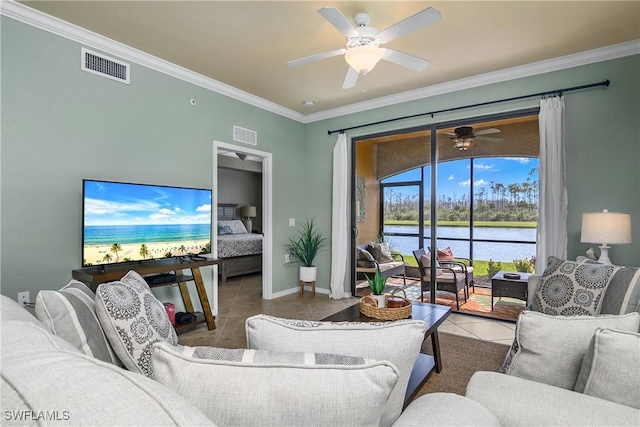 living area featuring crown molding, a ceiling fan, visible vents, and tile patterned floors