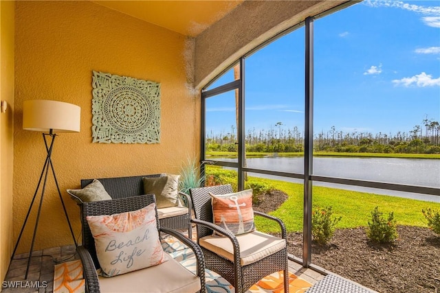 sunroom / solarium with a water view