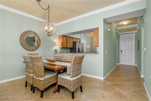 dining space featuring light tile patterned floors, crown molding, baseboards, and an inviting chandelier