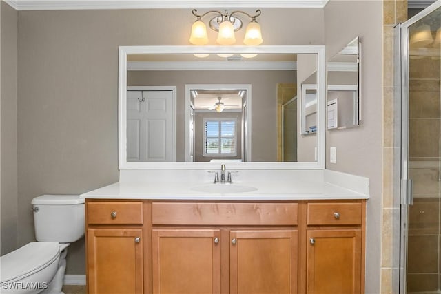 full bath featuring vanity, ornamental molding, a shower stall, and toilet