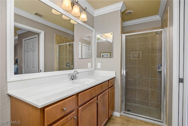 full bathroom with a stall shower, vanity, visible vents, and ornamental molding