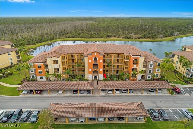 bird's eye view featuring a water view and a view of trees