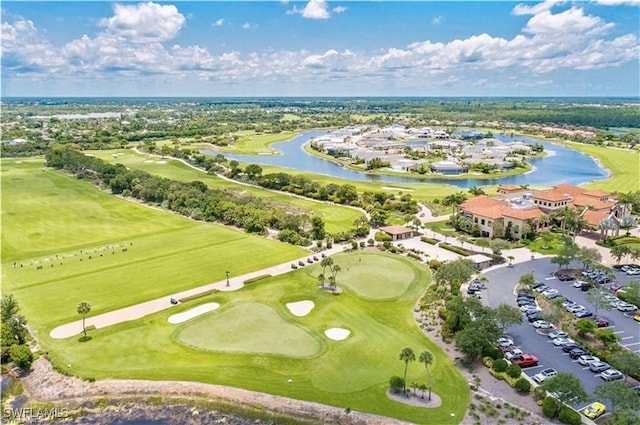 bird's eye view featuring view of golf course and a water view