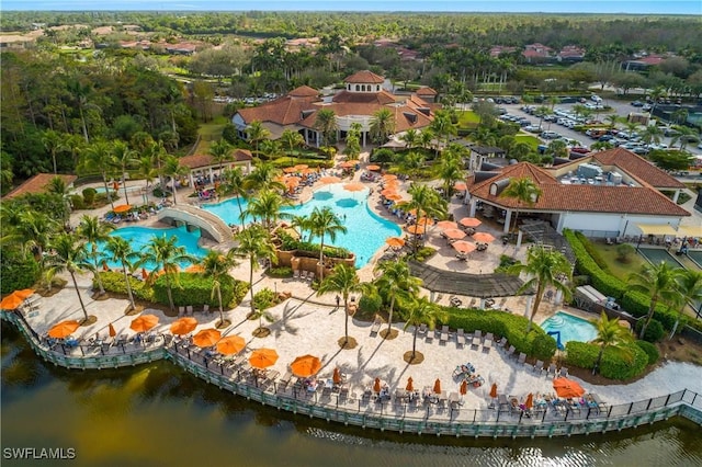 birds eye view of property with a water view