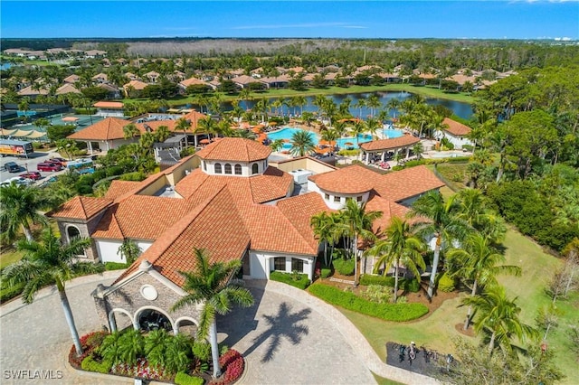 bird's eye view featuring a water view and a residential view