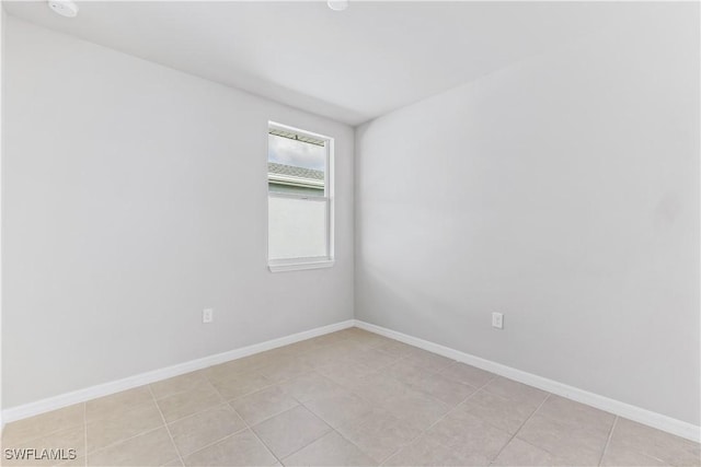 empty room with baseboards