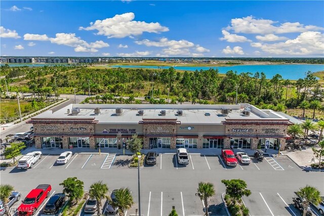 bird's eye view of a commercial area and a large body of water