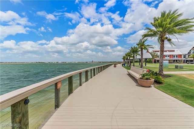dock featuring a water view and a yard