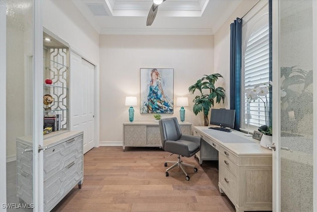 home office with baseboards, light wood-type flooring, a ceiling fan, and crown molding