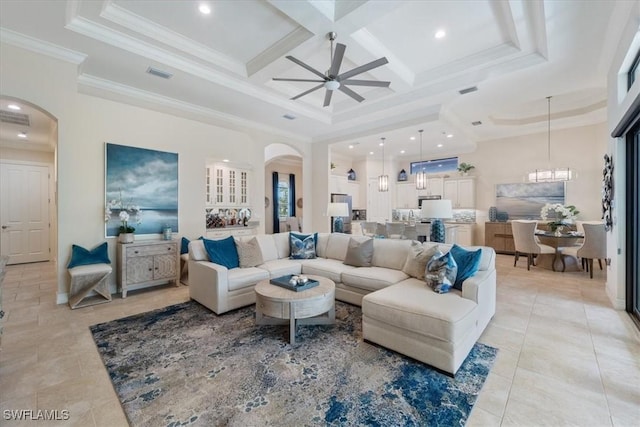 living room with arched walkways, a high ceiling, coffered ceiling, and visible vents