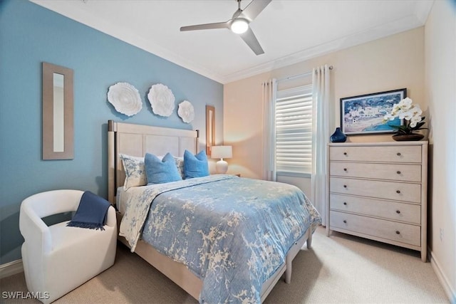 bedroom with baseboards, ornamental molding, a ceiling fan, and light colored carpet