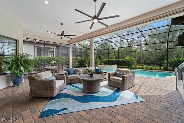 view of patio with a pool with connected hot tub, a lanai, ceiling fan, and an outdoor hangout area