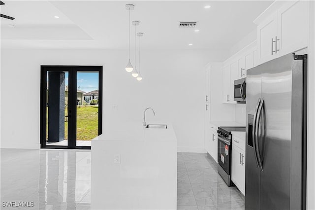 kitchen featuring stainless steel appliances, a sink, visible vents, white cabinetry, and marble finish floor