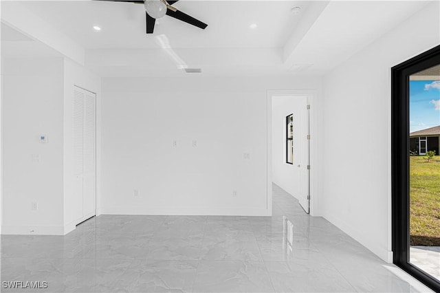 unfurnished room with marble finish floor, baseboards, a wealth of natural light, and recessed lighting