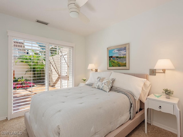 bedroom with ceiling fan, visible vents, baseboards, and light colored carpet