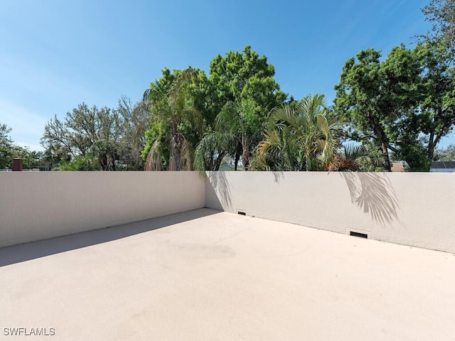 view of patio featuring fence