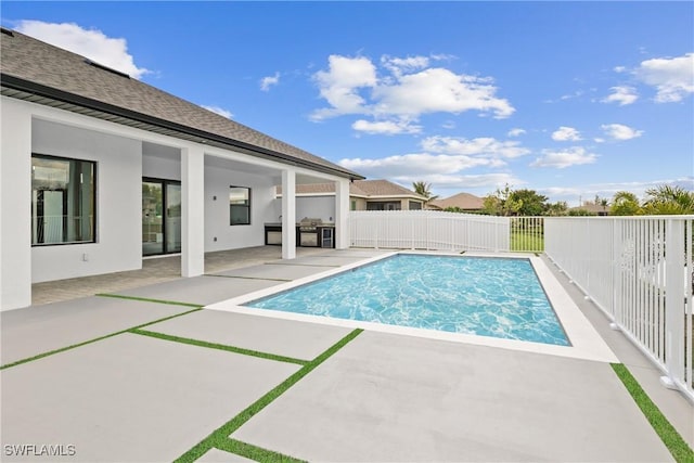 view of pool with a fenced backyard, area for grilling, a fenced in pool, and a patio