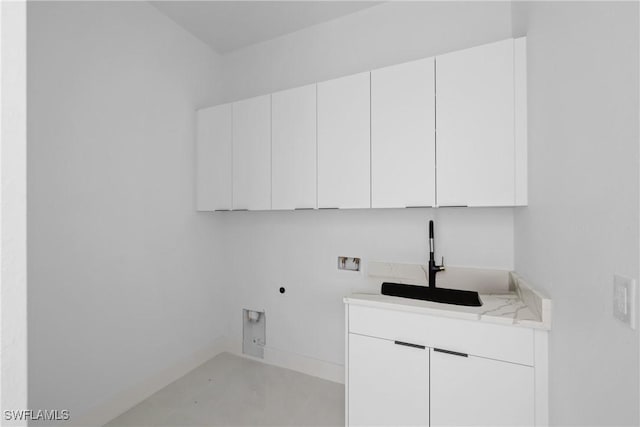 laundry area featuring a sink, cabinet space, hookup for a washing machine, and electric dryer hookup