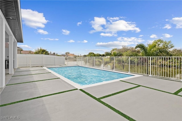 view of pool featuring a water view, a fenced backyard, a fenced in pool, and a patio