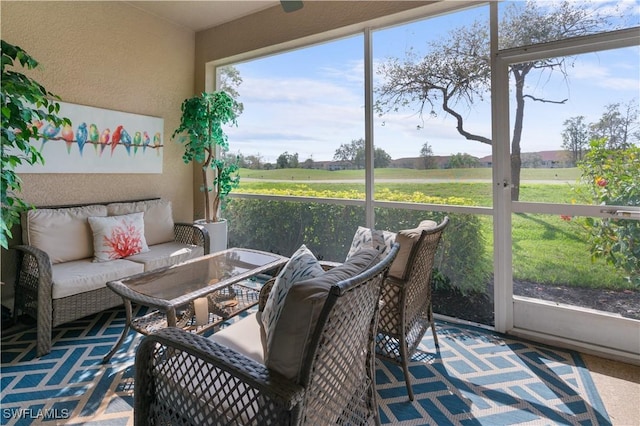 sunroom / solarium with a rural view