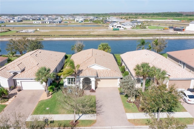 bird's eye view with a water view and a residential view