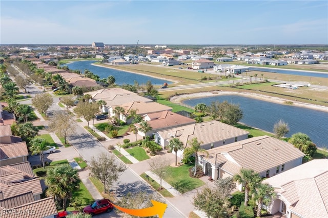 aerial view featuring a residential view and a water view