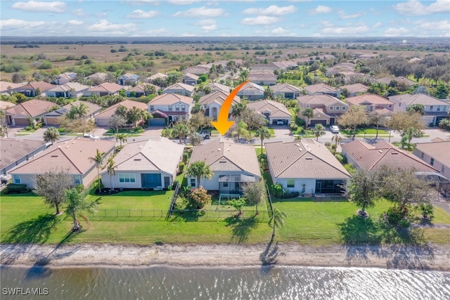 aerial view with a water view and a residential view