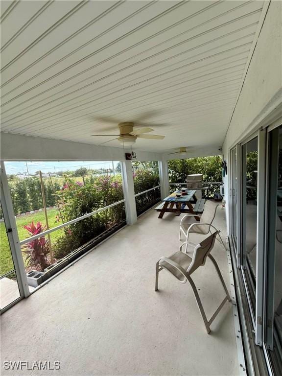 exterior space with a ceiling fan