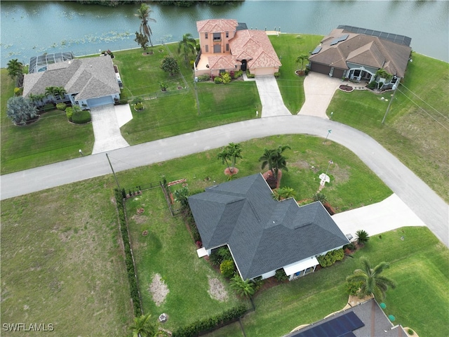 birds eye view of property featuring a water view