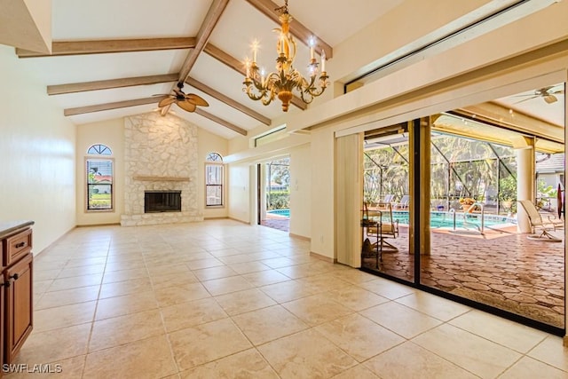 unfurnished living room featuring light tile patterned floors, a sunroom, beam ceiling, and a ceiling fan