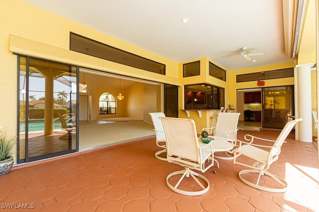 view of patio / terrace featuring ceiling fan