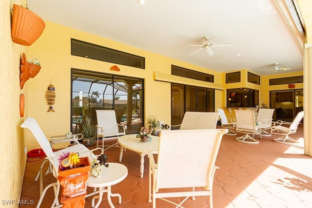 view of patio / terrace with ceiling fan and outdoor dining space