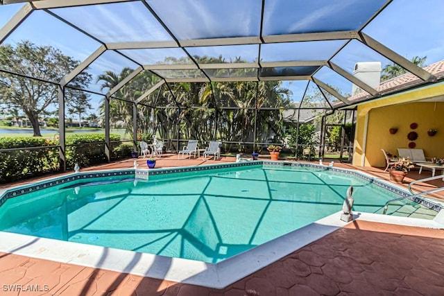 outdoor pool featuring a patio and a lanai