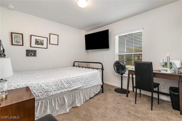 carpeted bedroom with baseboards