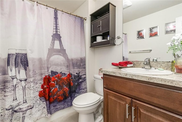 bathroom featuring vanity and toilet