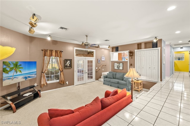 living room featuring visible vents, baseboards, light tile patterned floors, recessed lighting, and french doors