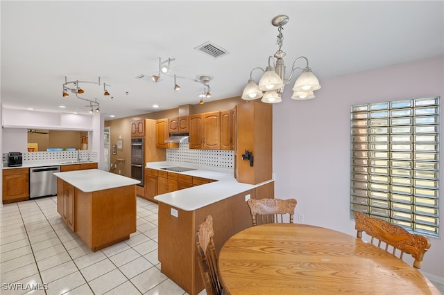 kitchen featuring visible vents, light tile patterned flooring, stainless steel appliances, light countertops, and a center island