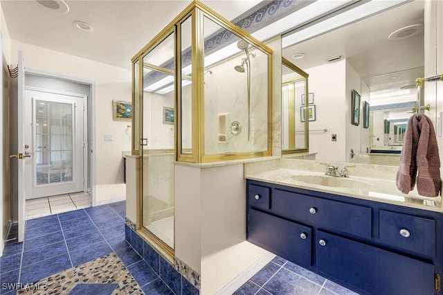 full bathroom featuring tile patterned flooring, visible vents, a stall shower, and vanity