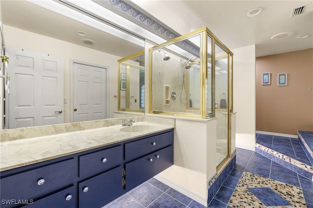 full bath featuring visible vents, a stall shower, tile patterned flooring, baseboards, and vanity