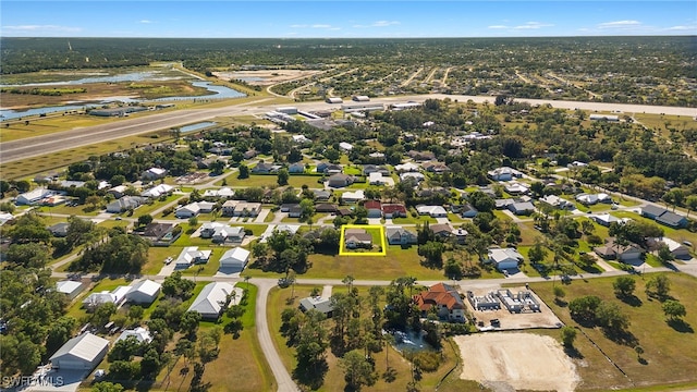 bird's eye view with a water view and a residential view