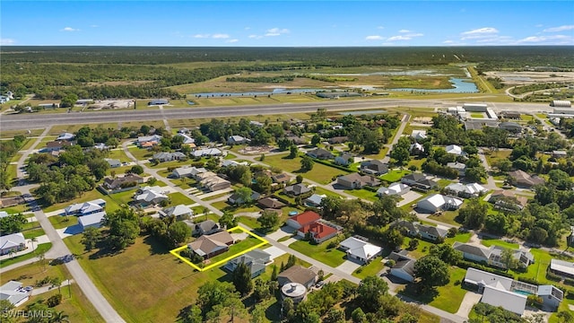 aerial view featuring a water view and a residential view