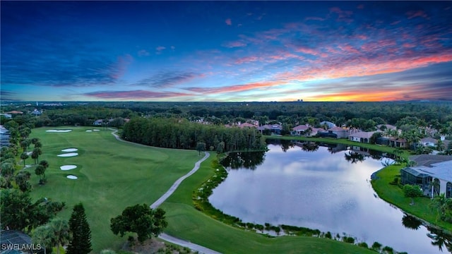 drone / aerial view featuring view of golf course and a water view