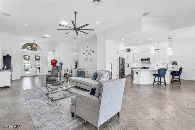 living area featuring french doors, crown molding, recessed lighting, visible vents, and baseboards