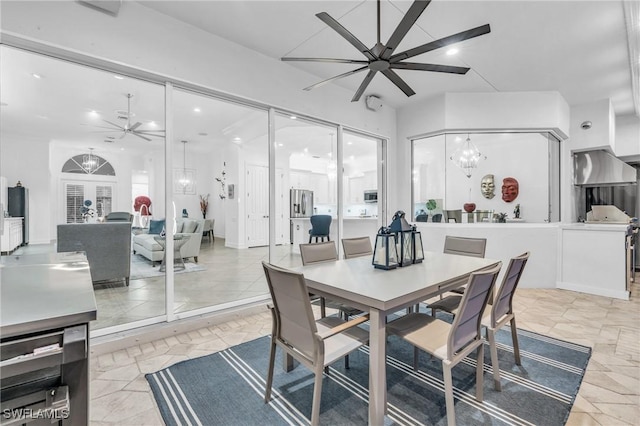 dining area with ceiling fan with notable chandelier and recessed lighting