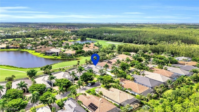 drone / aerial view featuring a water view and a residential view