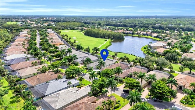 bird's eye view with golf course view, a water view, and a residential view