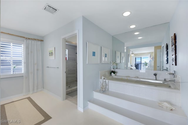 bathroom featuring recessed lighting, visible vents, and baseboards