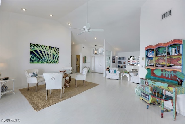 living room with ceiling fan, high vaulted ceiling, recessed lighting, wood finished floors, and visible vents