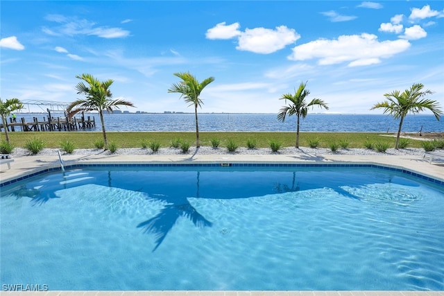 outdoor pool featuring a water view